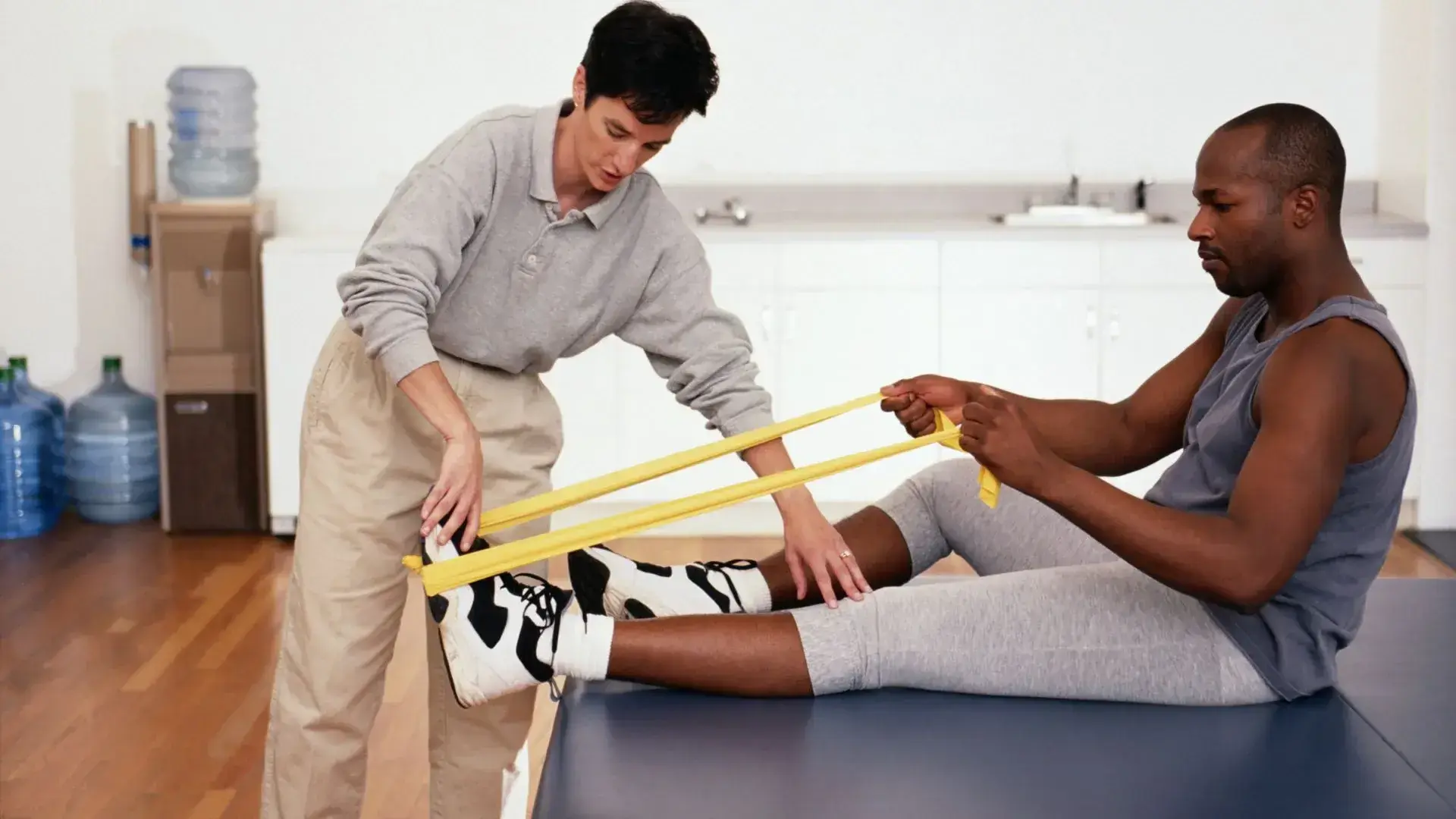 Physiotherapist performing manual therapy assessment for back pain at Physio Cure Point clinic in Surathkal, Mangaluru
